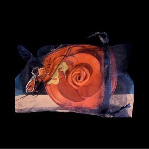 Inquest.d orange flower wristlet 5 1/2 x 5 1/2 cute!!